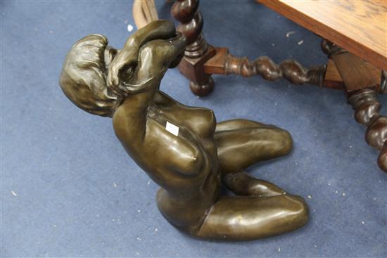 After Enzo Plazzota. A bronze model of a seated nude woman, height 25in.